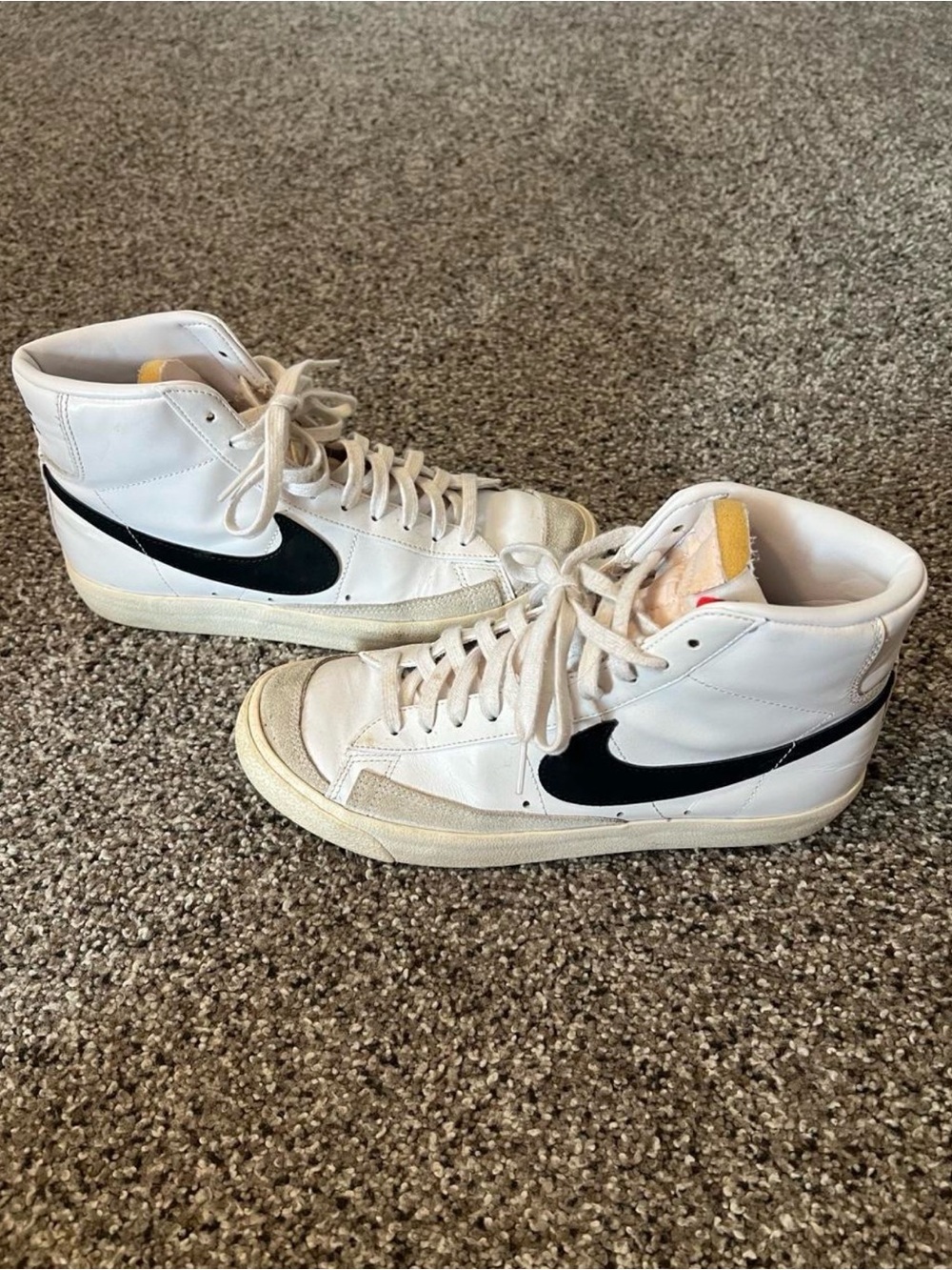 Nike White High-Top Sneakers with Black Swoosh